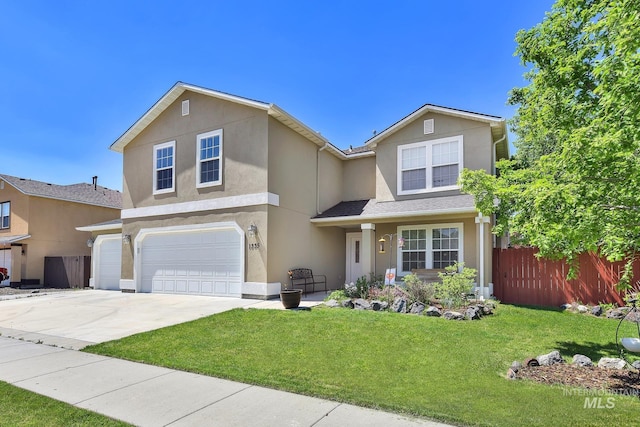 traditional-style house with stucco siding, a garage, and concrete driveway