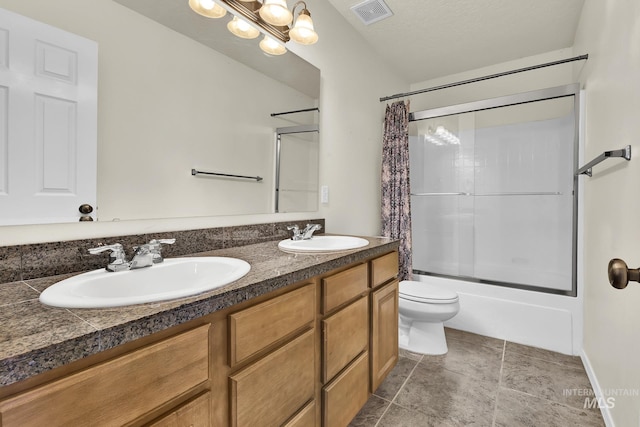 full bath with shower / tub combo, toilet, double vanity, and stone finish floors