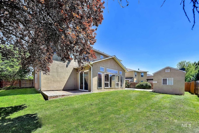 rear view of property with stucco siding