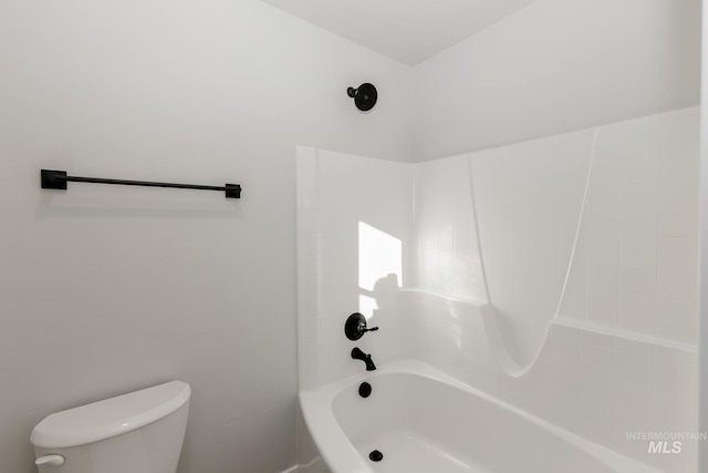 bathroom with shower / washtub combination and toilet