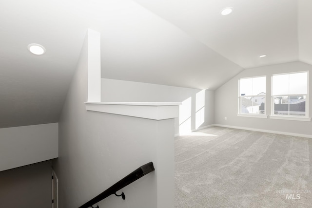 bonus room featuring light carpet, recessed lighting, baseboards, and vaulted ceiling