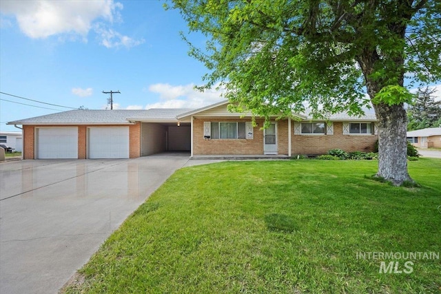 1425 H St, Rupert, ID 83350 - single story home with concrete driveway, brick siding, a front lawn, a garage, and an attached carport