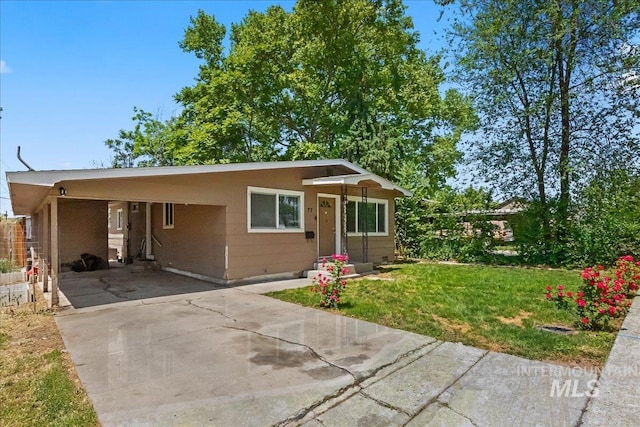 77 S Canyon St, Nampa, ID 83651 - view of front of home with driveway, a front yard, and a carport
