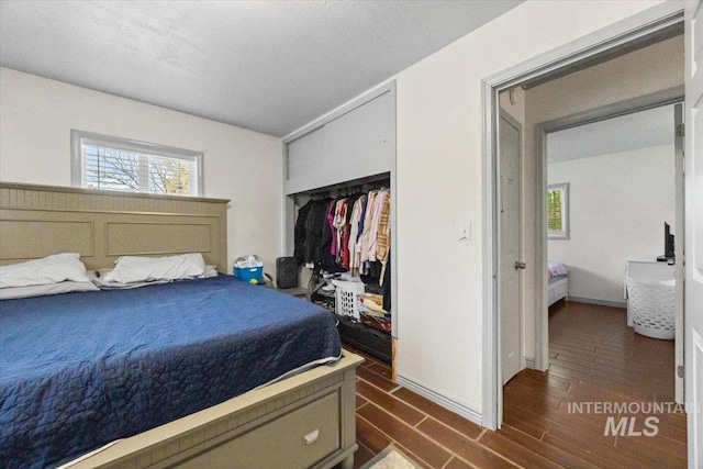 77 S Canyon St, Nampa, ID 83651 - bedroom featuring dark wood-type flooring and a closet