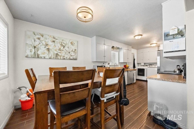 77 S Canyon St, Nampa, ID 83651 - dining room featuring wood tiled floors, healthy amount of natural light, and washer / clothes dryer