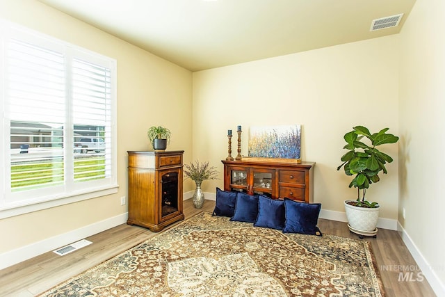 living area with hardwood / wood-style floors