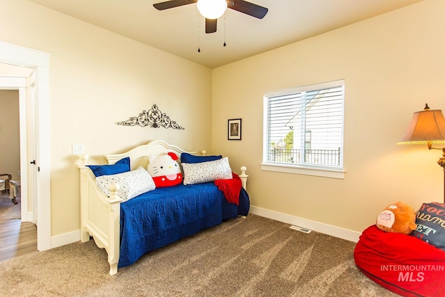 carpeted bedroom with ceiling fan