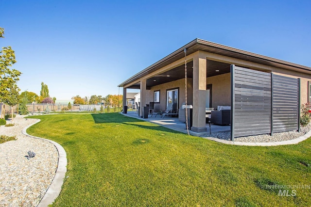 exterior space with an outdoor hangout area and a patio