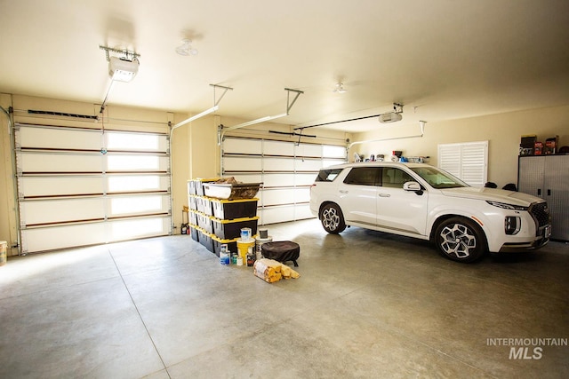 garage featuring a garage door opener