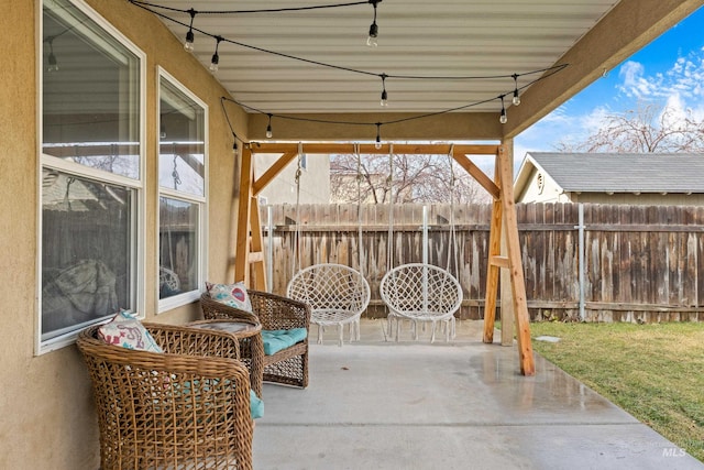 view of patio / terrace featuring fence