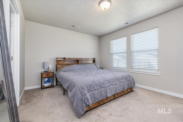 17719 Jackson Ridge Way, Nampa, ID 83687 - carpeted bedroom with a textured ceiling and baseboards