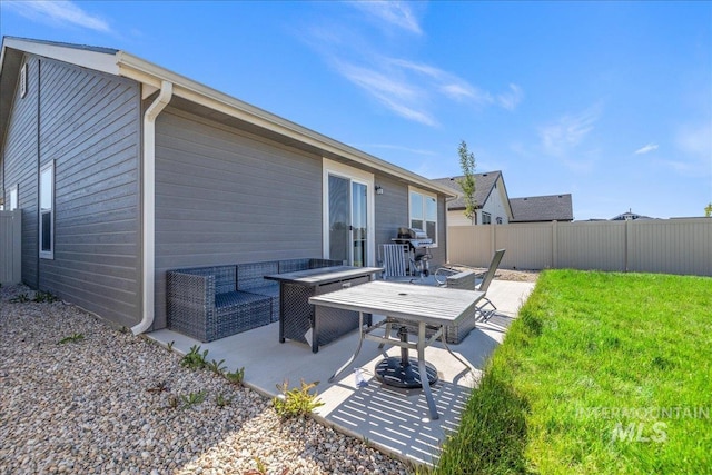 17719 Jackson Ridge Way, Nampa, ID 83687 - rear view of house with a patio