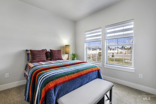 carpeted bedroom with baseboards