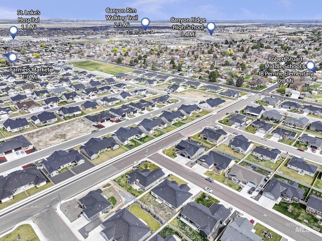 birds eye view of property with a residential view