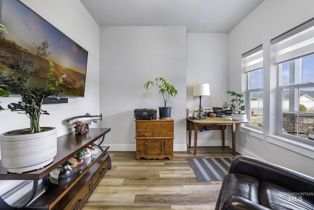 office featuring light wood-style flooring and baseboards