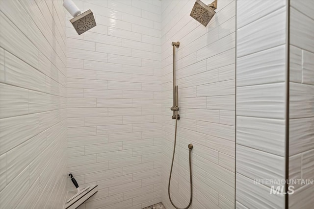 full bath featuring a tile shower