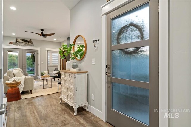 doorway to outside featuring french doors, wood finished floors, ceiling fan, recessed lighting, and baseboards