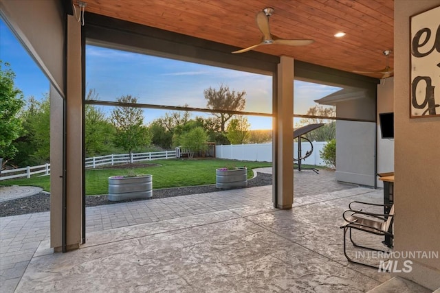 view of patio featuring a ceiling fan
