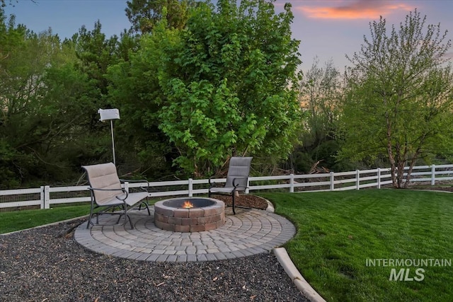 view of yard with a fire pit and a patio