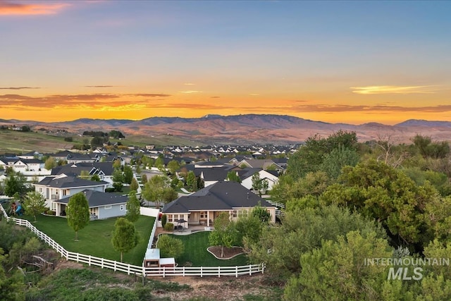 aerial view at dusk of a mountain view and a residential view