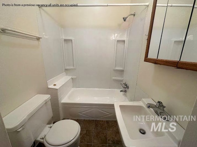 bathroom with tile patterned floors,  shower combination, and toilet