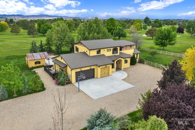 aerial view of property and surrounding area featuring a mountain backdrop