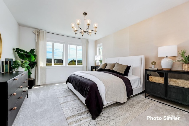 bedroom featuring light carpet, a chandelier, and baseboards