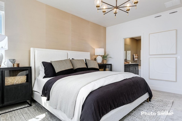 bedroom featuring a chandelier, visible vents, light colored carpet, and connected bathroom