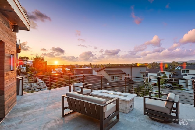 885 E Joplin Ln, Eagle, ID 83616 - patio terrace at dusk with a fire pit and a balcony