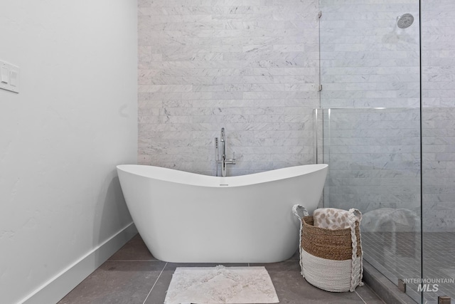 885 E Joplin Ln, Eagle, ID 83616 - bathroom featuring a freestanding bath, a walk in shower, and tile patterned floors