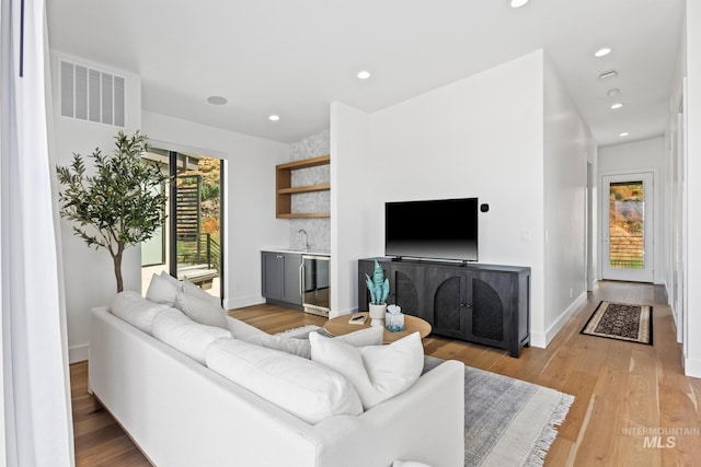885 E Joplin Ln, Eagle, ID 83616 - living room with a bar, recessed lighting, light wood-type flooring, and wine cooler
