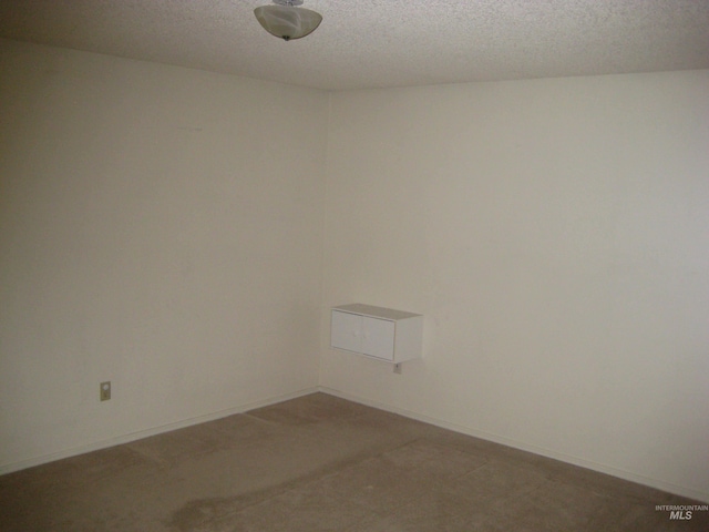 11254 W Camas St, Boise, ID 83709 - spare room with a textured ceiling and light carpet