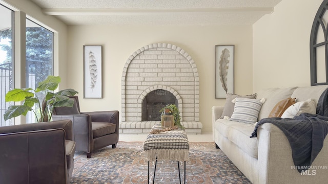 11254 W Camas St, Boise, ID 83709 - living room featuring a fireplace, beam ceiling, and a textured ceiling