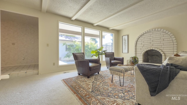 11254 W Camas St, Boise, ID 83709 - living area featuring beam ceiling, a brick fireplace, carpet, and a textured ceiling
