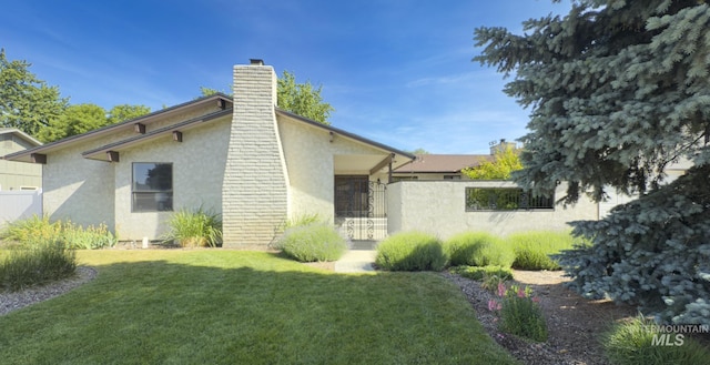 11254 W Camas St, Boise, ID 83709 - view of home's exterior featuring stucco siding and a chimney