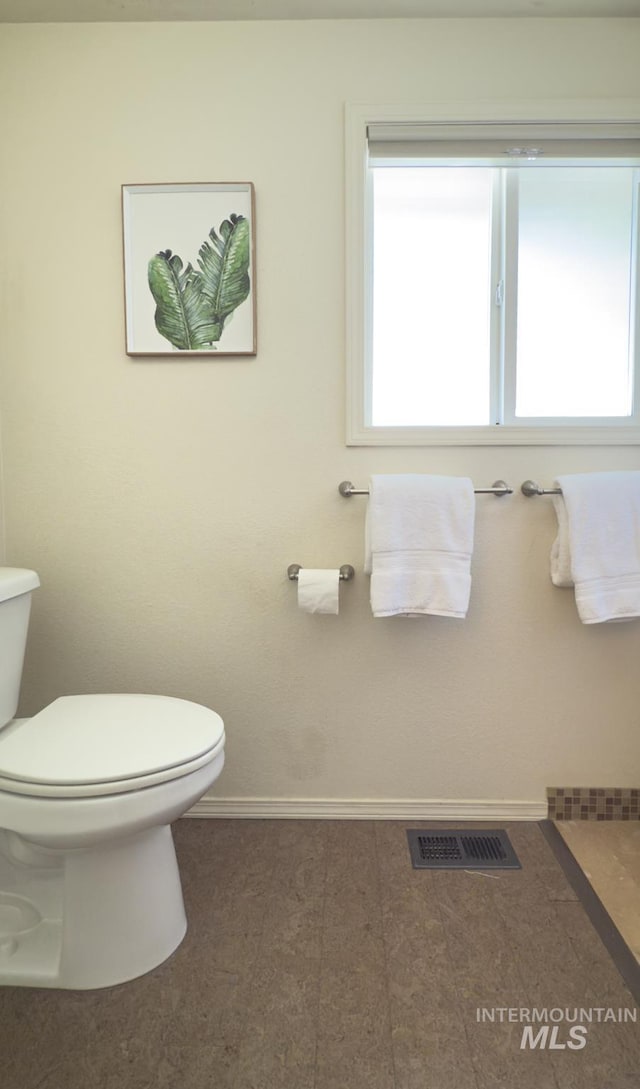 11254 W Camas St, Boise, ID 83709 - bathroom featuring toilet, plenty of natural light, and baseboards