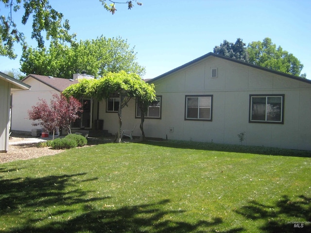 11254 W Camas St, Boise, ID 83709 - rear view of property featuring a yard