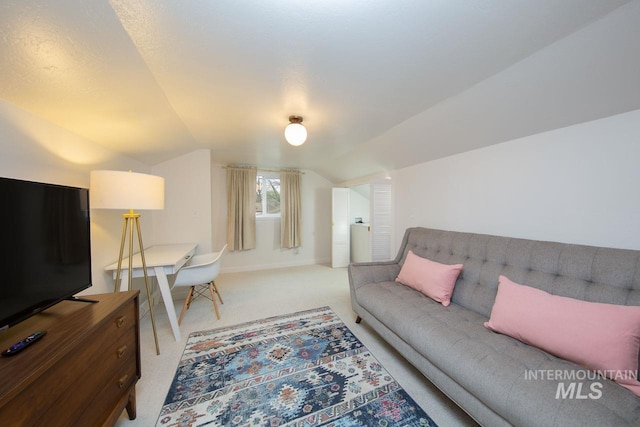 living room featuring lofted ceiling, carpet, and baseboards