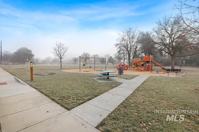 view of playground with a lawn