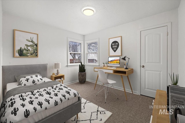 carpeted bedroom with a textured ceiling