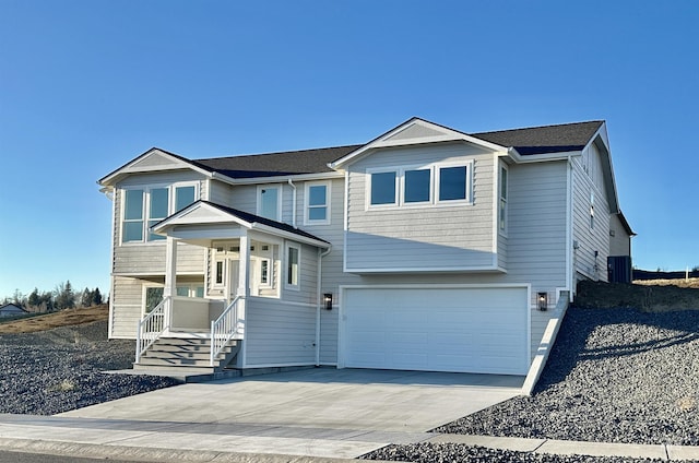 view of front of property with driveway and an attached garage