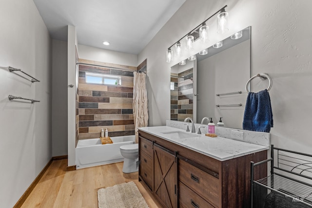 3383 Ridge Dr, Mccall, ID 83638 - full bath featuring vanity, wood finished floors, and shower / bath combo with shower curtain