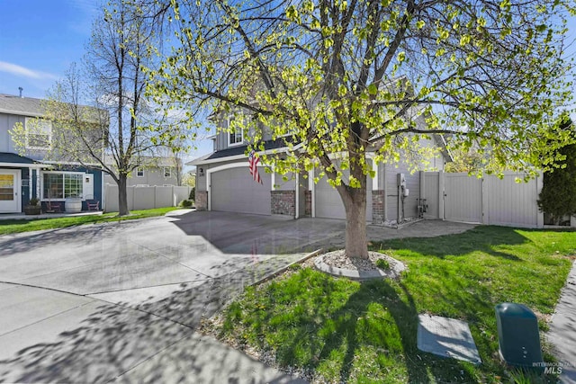 obstructed view of property featuring brick siding, fence, concrete driveway, a front yard, and a garage