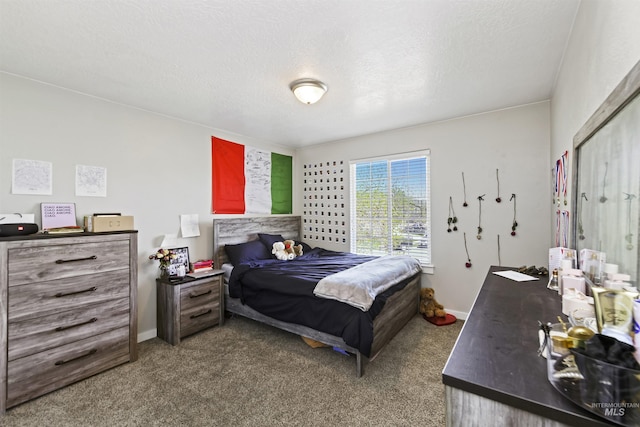 bedroom featuring carpet flooring, baseboards, and a textured ceiling