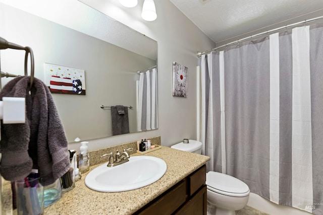 bathroom featuring curtained shower, toilet, and vanity