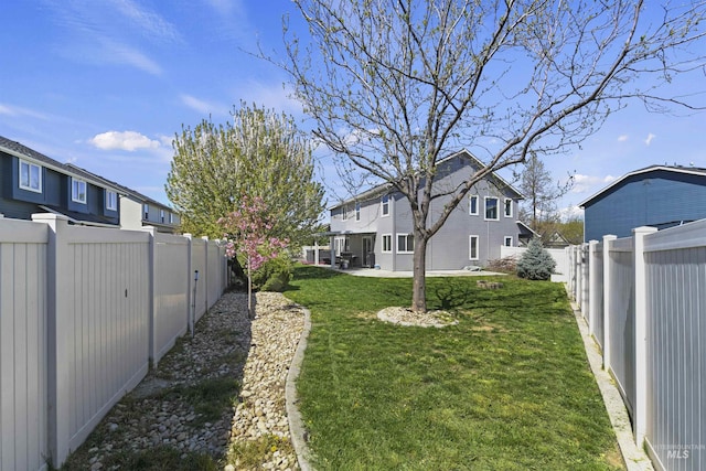 view of yard with a residential view and a fenced backyard