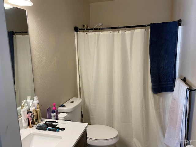 2329 S Garland St, Nampa, ID 83686 - full bath with toilet, vanity, a shower with curtain, and a textured wall