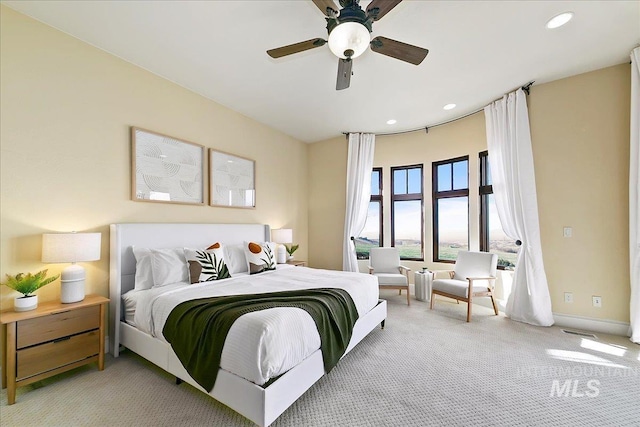 bedroom with ceiling fan and carpet floors