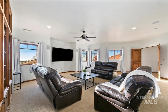 living room featuring ceiling fan and carpet flooring