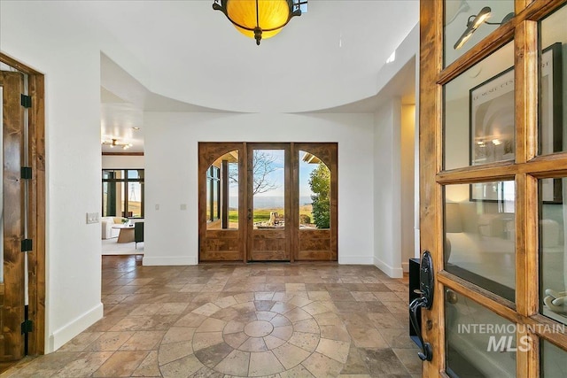 tiled foyer with french doors